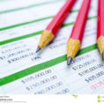 Spreadsheet Table Paper With Pencil. Finance Development, Banking And Spreadsheet Development