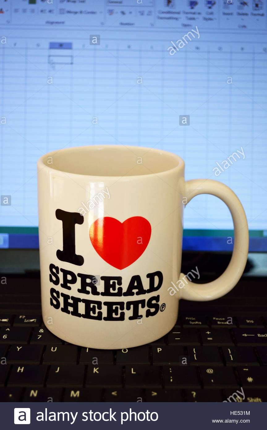 Excel Spreadsheet Mug For An "i Love Spreadsheets" Mug On A Laptop Keyboard And An Excel Stock