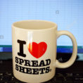 I Love Spreadsheets Pertaining To An "i Love Spreadsheets" Mug On A Laptop Keyboard And An Excel Stock